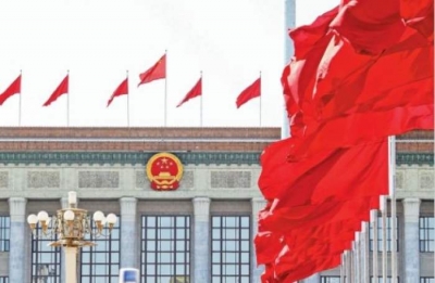 人民日报评论员：没有什么能阻挡中国前进的坚定步伐 