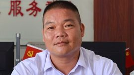 徐文坚：“反哺”家乡 贫困村建成省级美丽乡村