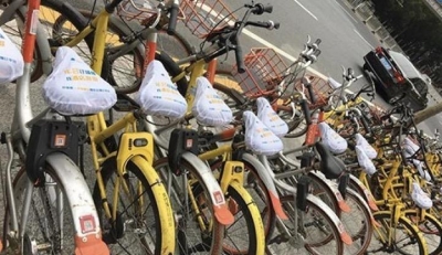 20万辆共享单车被套上车座广告  摩拜单车索赔100万元