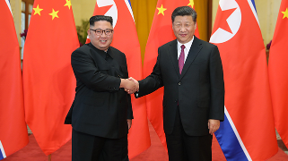 习近平会见朝鲜劳动党委员长金正恩