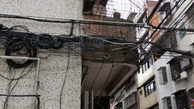 茶座丨治理城市“蜘蛛网”乱象刻不容缓